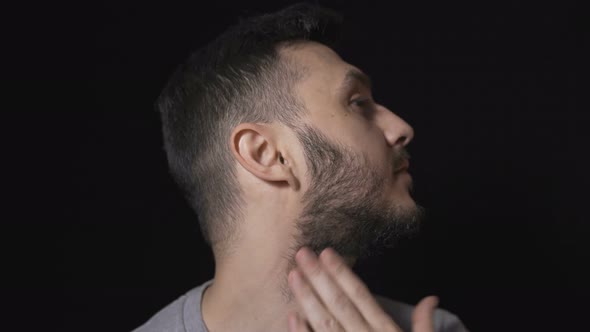 Man Preparing To Shave His Beard with Electric Razor