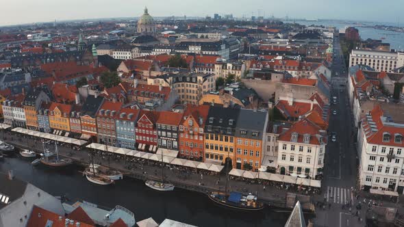Famous Nyhavn Pier with Colorful Buildings and Boats in Copenhagen Denmark