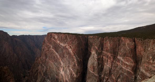 Black Canyon of Gunnison National Park in Colorado time lapse of clouds and sun over canyon.