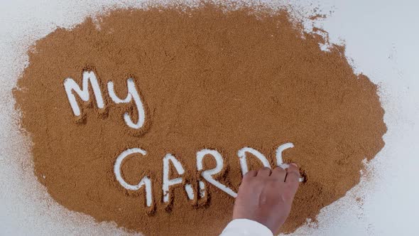 Hand Writes On Soil My Garden