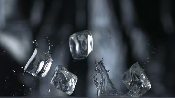 Cubes falling and bouncing on puddle, Slow Motion alt