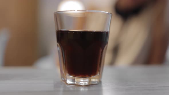 Glass of Fizzy Drink on the Table