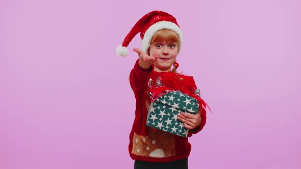 Happy Teen Toddler Girl Kid Wears Red Christmas Sweater Presenting Christmas Gift Box Shopping Sale