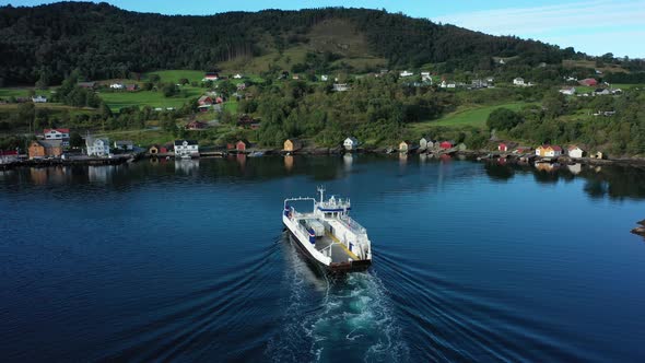 Electric ferry Ytteroyningen from Norled company arriving port of Utbjoa in Rogaland Norway - Sunny