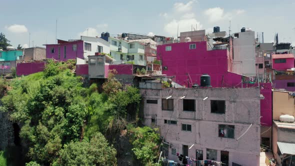 Pink Low-income Slum Building in Mexico Suburban. Mexico City on Background, 