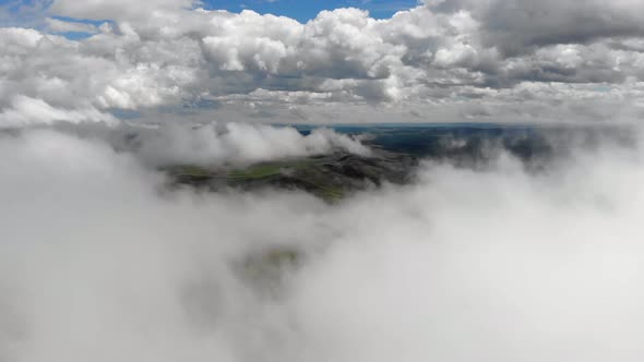 Central Asian Steppes Through Clouds