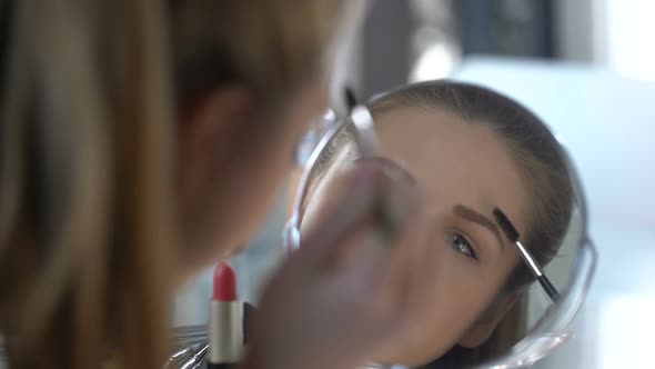 Lady Making Final Touches in Her Make-Up, Happy With Her Beauty, Reflection