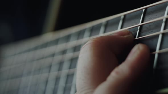 The musician plays the acoustic guitar