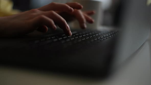 Closeup Hands of Unrecognizable Child Boy Typing on Laptop Keyboard and Surfing Internet Sitting at