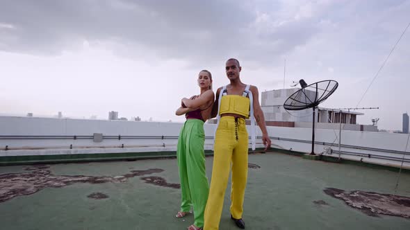 Models In Clubwear Dancing And Performing Together On Skyscraper