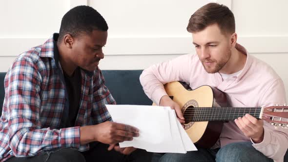 Two Friends Learn to Play Acoustic Guitar