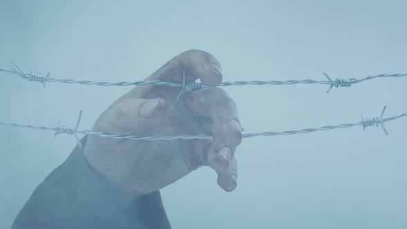 Hand Hanging On Wire - War Concept