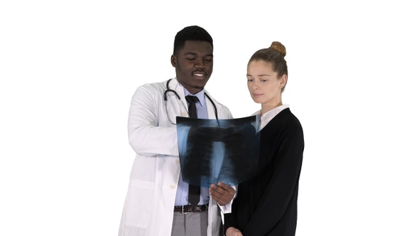 Doctor Shows the Patient Chest X-Ray on White Background