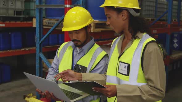 Workers interacting in a warehouse