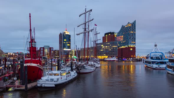 Dusk Time Lapse of the harbor district, the concert hall and ships in foreground, Hamburg, Germany