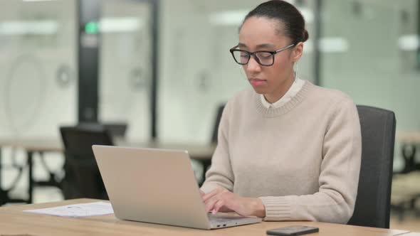 Creative African Woman with Laptop Saying No By Finger Sign