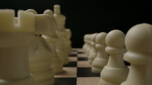 White Chess Pieces in Start Row Position Ready to Game