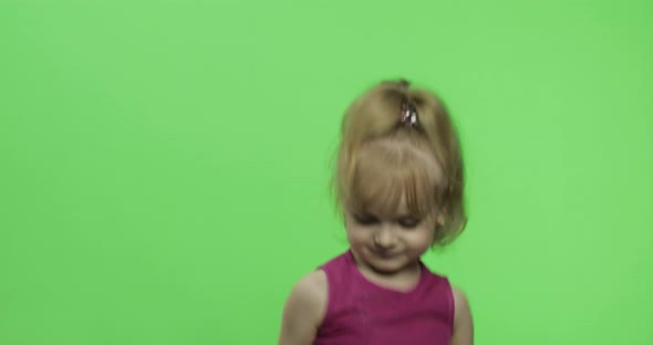 Girl in Purple Dress Dancing. Happy Four Years Old Child. Chroma Key