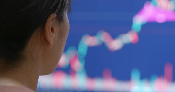 Woman study the stock market on computer