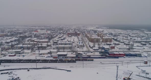 Sovetskiy city. Railway station and the trains.  Aerial. Winter, snow 10