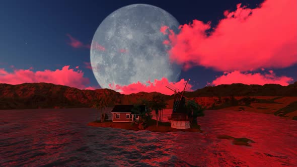 Full Moon and red clouds over the mountains