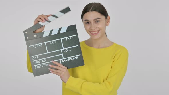 Spanish Woman Showing Clapperboard on White Background