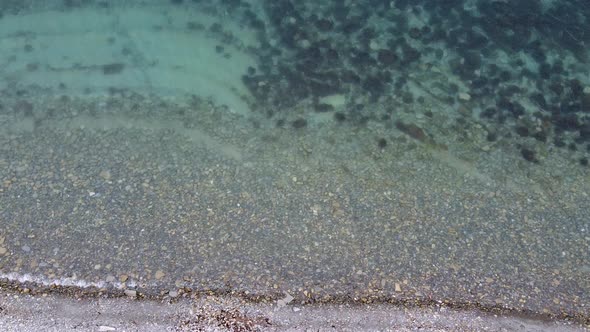 Transparent sea water. Rocky bottom. Geology of the seabed