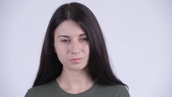 Face of Serious Young Woman Thinking and Looking Down