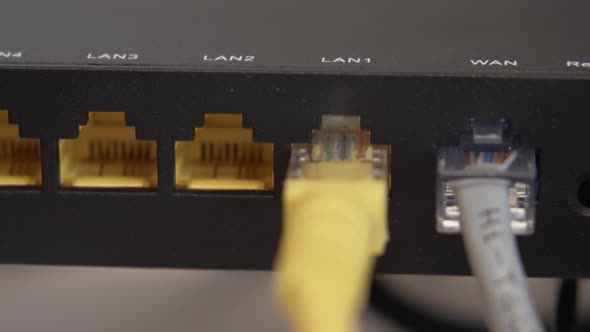 Yellow Internet LAN Cable Connected with Router. Equipment, Technology