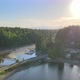 Golden Sunset behind green trees water small bridge distant mountain mud creek river beautiful coast - VideoHive Item for Sale