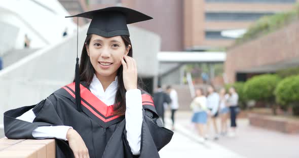 Cheerful asian woman get graduation 