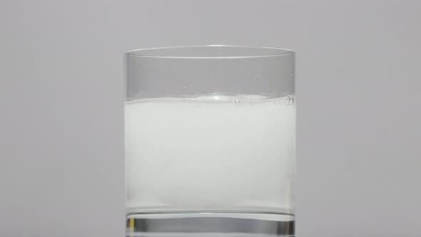 Tablet Fizzes In Glass Of Water