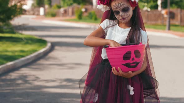 Portrait of Girl in Halloween Costume Posing Outdoors