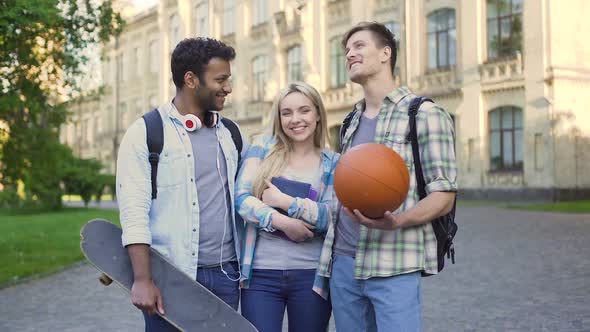 Young Men Chatting and Flirting With Pretty Blonde Near College, Students