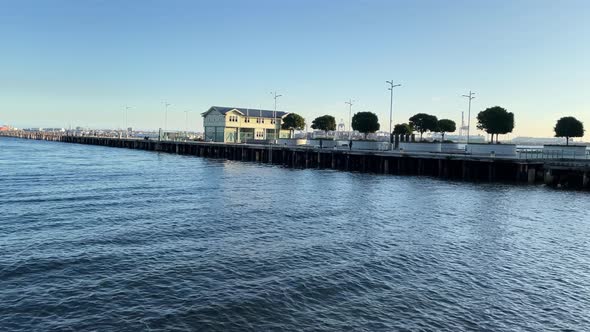 A static view of the historical Princess Pier in Port Melbourne on a clear afternoon with the ocean