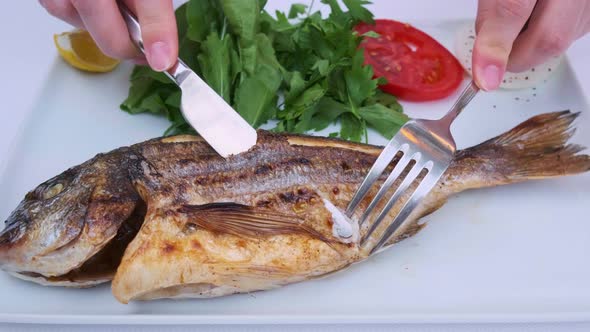 Baked whole sea bream with vegetables