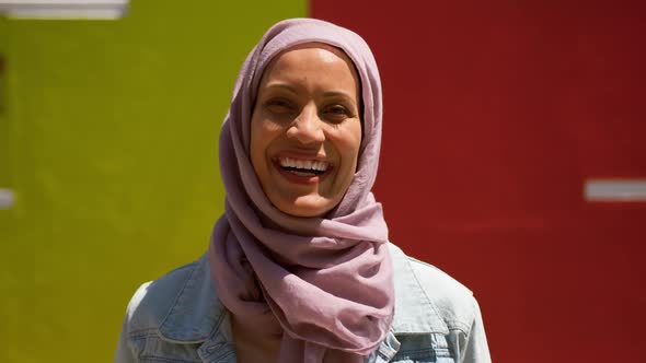 Young woman wearing hijab out and about in the city