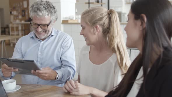 Insurance Agent and Customers Meeting in Co-working Space