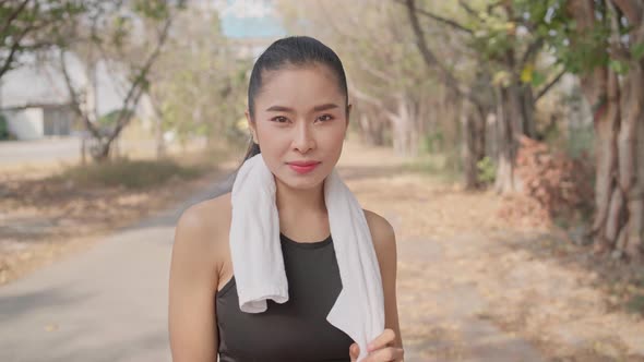 Portrait of female runner smiling to camera