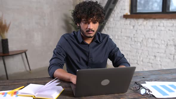 Portrait of Smiling and Friendly Multi Ethnic Male Freelancer