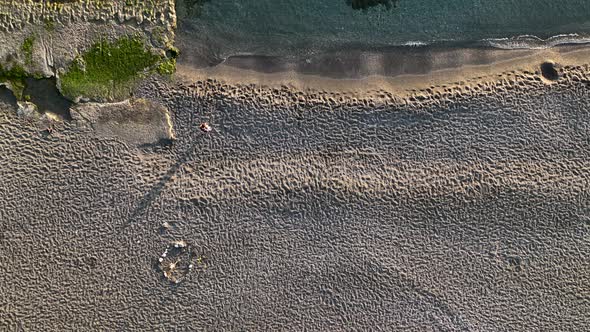 Texture of the rocky beach aerial view 4 K Turkey Alanya