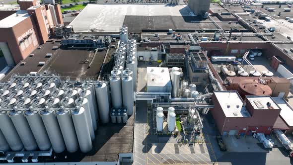 Beer brewery in USA. Aerial of stainless steel holding tanks for fermentation and distillation.