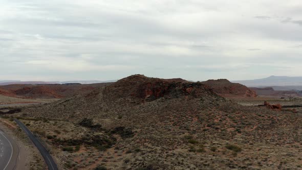 Aerial Drone footage of the mountainous red rocks in southern Utah. Showing the sky, the mountains,