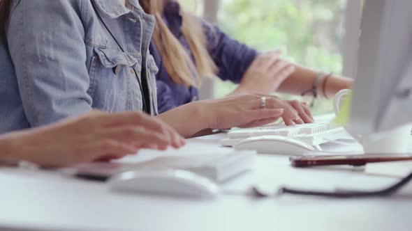 Close Up Shot of Businesswoman Hand Typing and Working on Computer on Desk