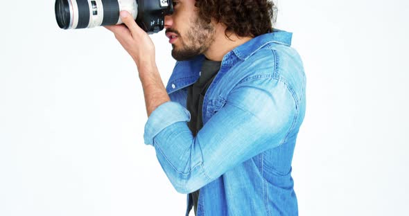 Photographer taking photo with professional digital camera