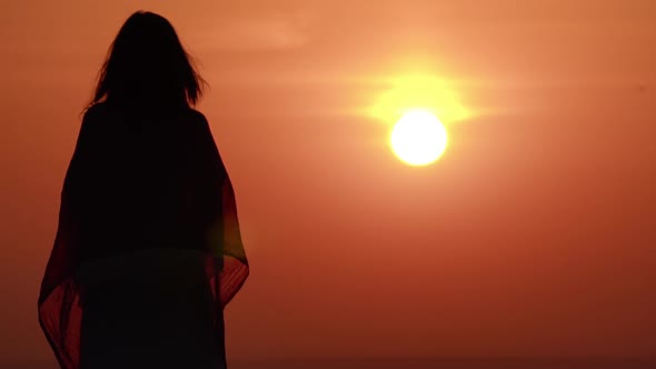 Female Enjoy Orange Sky with Rising Sun