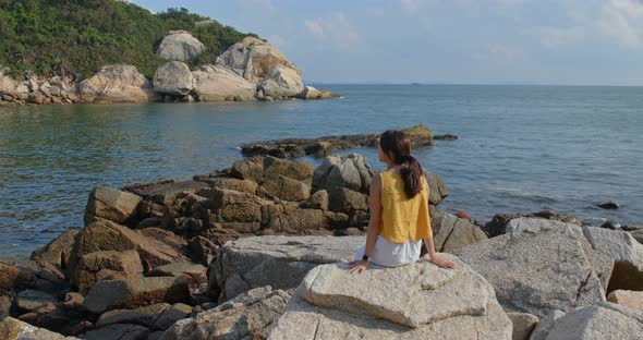 Woman enjoy the view of the sea