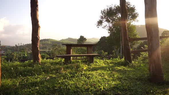 Wooden table during sunset far to close shot