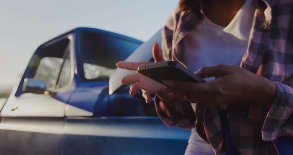 Young woman on a road trip in pick-up truck