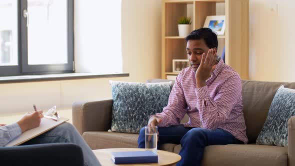 Man and Psychologist at Psychotherapy Session